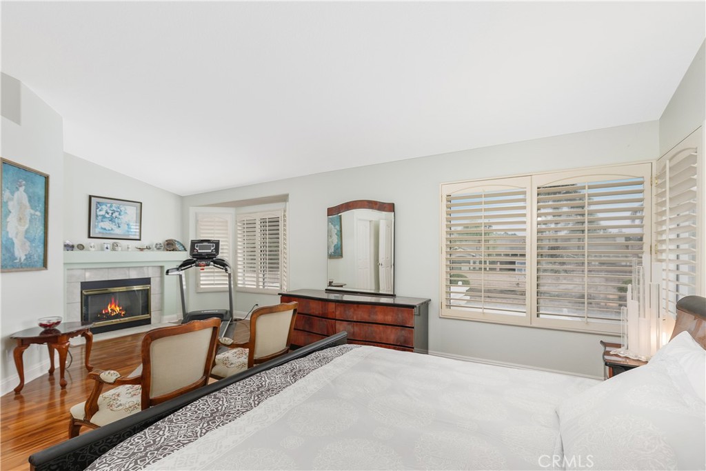 1874 Natalie Lane Riverside, CA 92506 - Photo 25 of 40 a bedroom with furniture and a fireplace