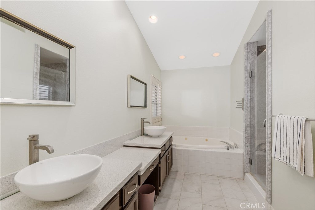 1874 Natalie Lane Riverside, CA 92506 - Photo 26 of 40 a bathroom with a tub sink and mirror