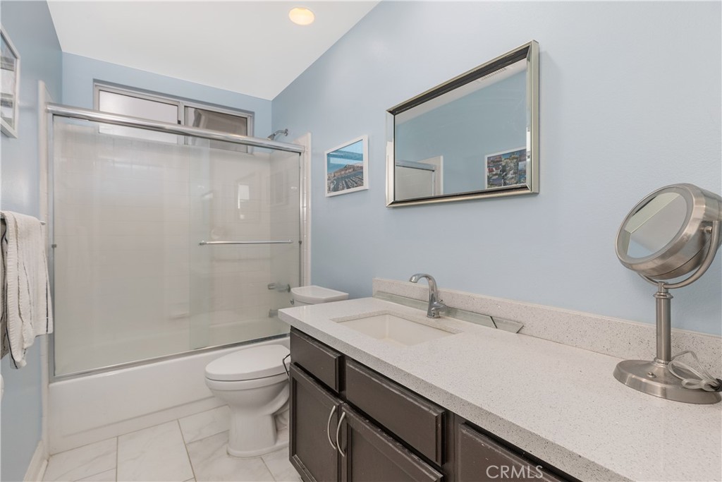 1874 Natalie Lane Riverside, CA 92506 - Photo 31 of 40 a bathroom with a sink a toilet and shower