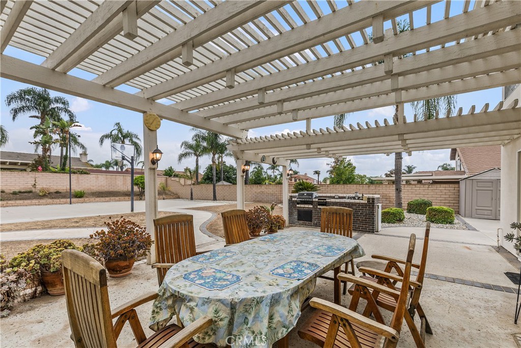 1874 Natalie Lane Riverside, CA 92506 - Photo 36 of 40 a view of a patio with a table and chairs and a barbeque