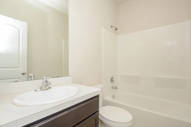a bathroom with a sink a toilet and a bathtub