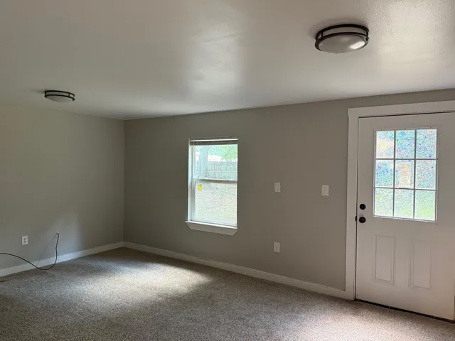 an empty room with windows