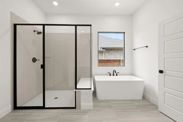 a bathroom with a bathtub and a sink
