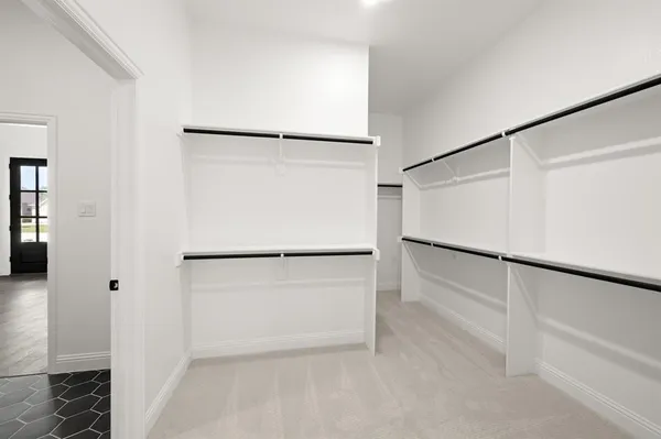 a white refrigerator freezer and a stove sitting inside of a kitchen