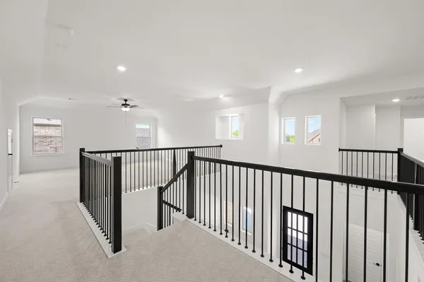 a view of a hallway with windows