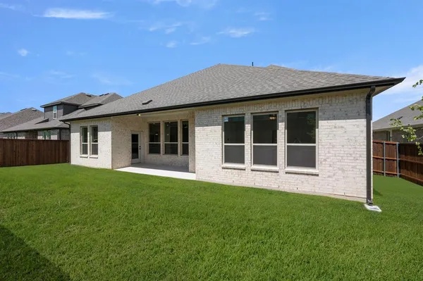 a view of an house with backyard space and garden