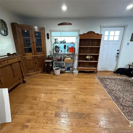 a bed room with a bed furniture and a flat tv screen