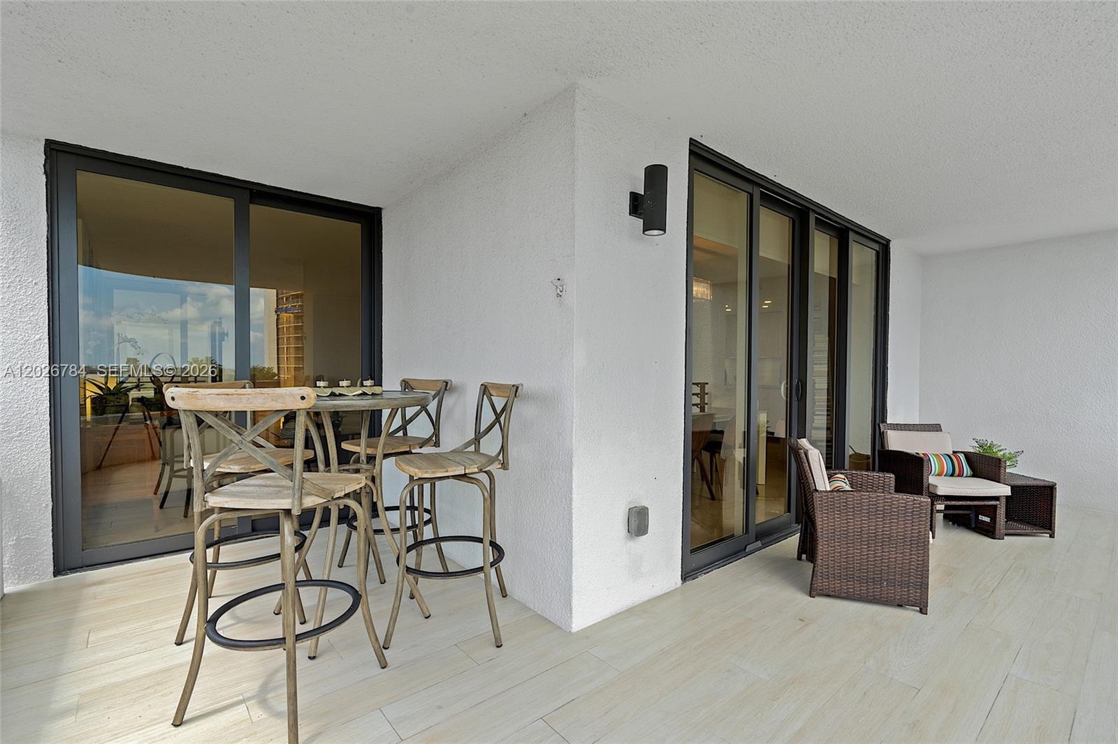 151 Southeast 15th Road, Unit 601 Miami, FL 33129 - Photo 10 of 36 a dining room with furniture and a potted plant