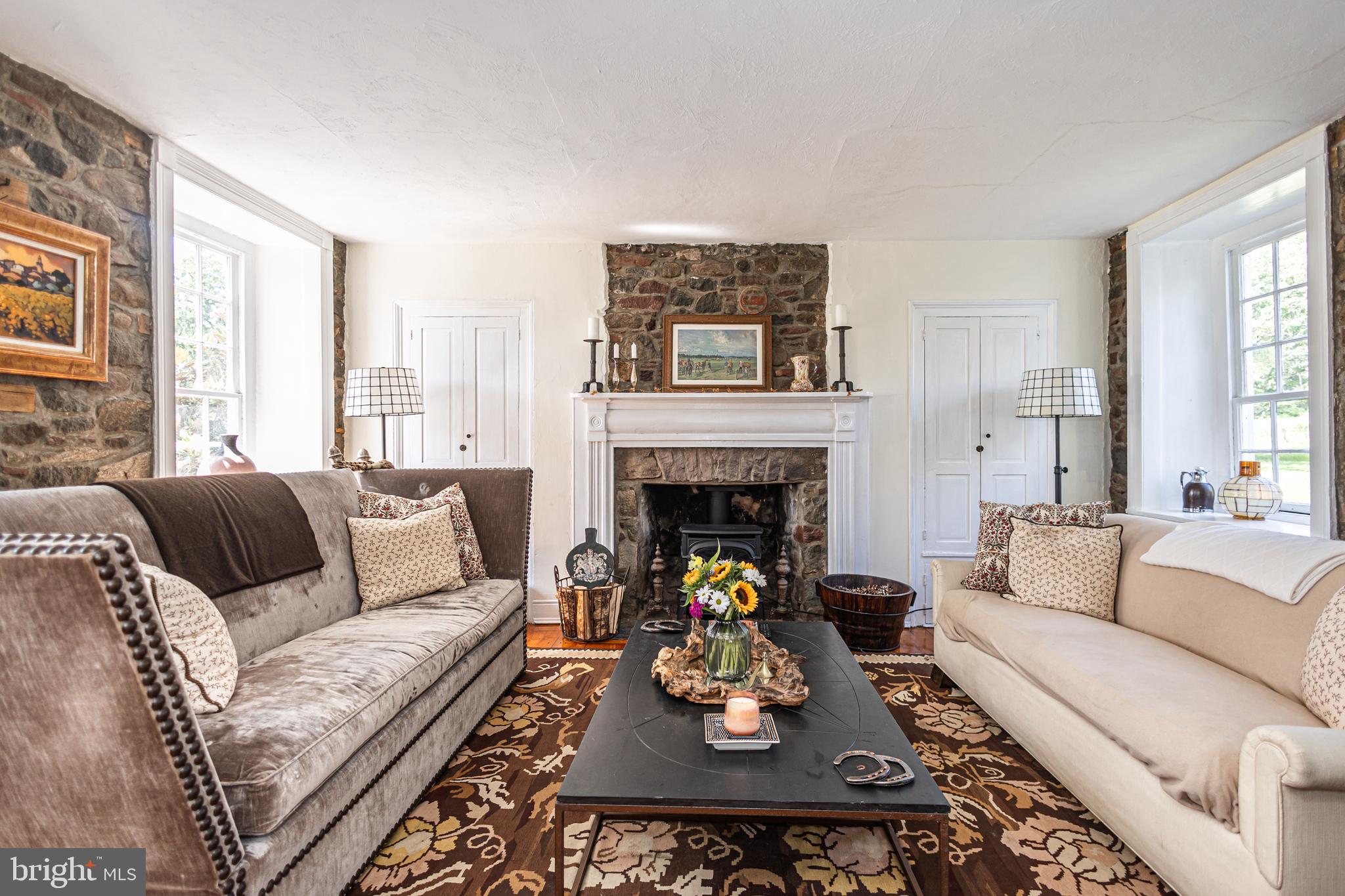 439 Brownsburg Road, Unit W Newtown, PA 18940 - Photo 13 of 68 a living room with furniture and a fireplace