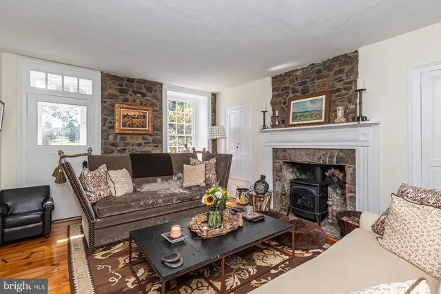 a bedroom with furniture and a flat screen tv