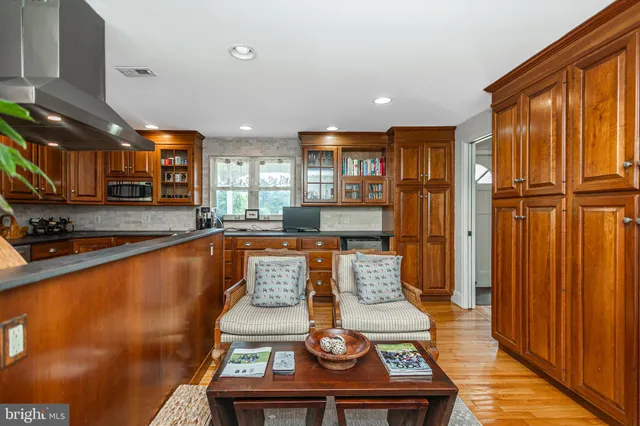 a living room with a bed furniture and a window