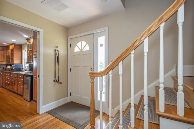 a spacious bathroom with a tub sink and mirror