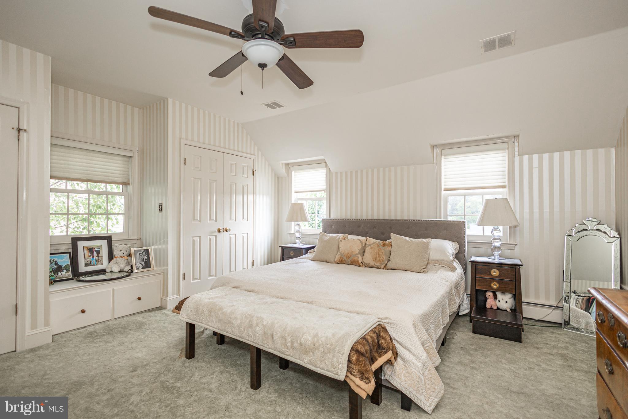 439 Brownsburg Road, Unit W Newtown, PA 18940 - Photo 27 of 68 a living room with a bed furniture and a window