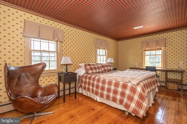 a living room with patio furniture and a large window