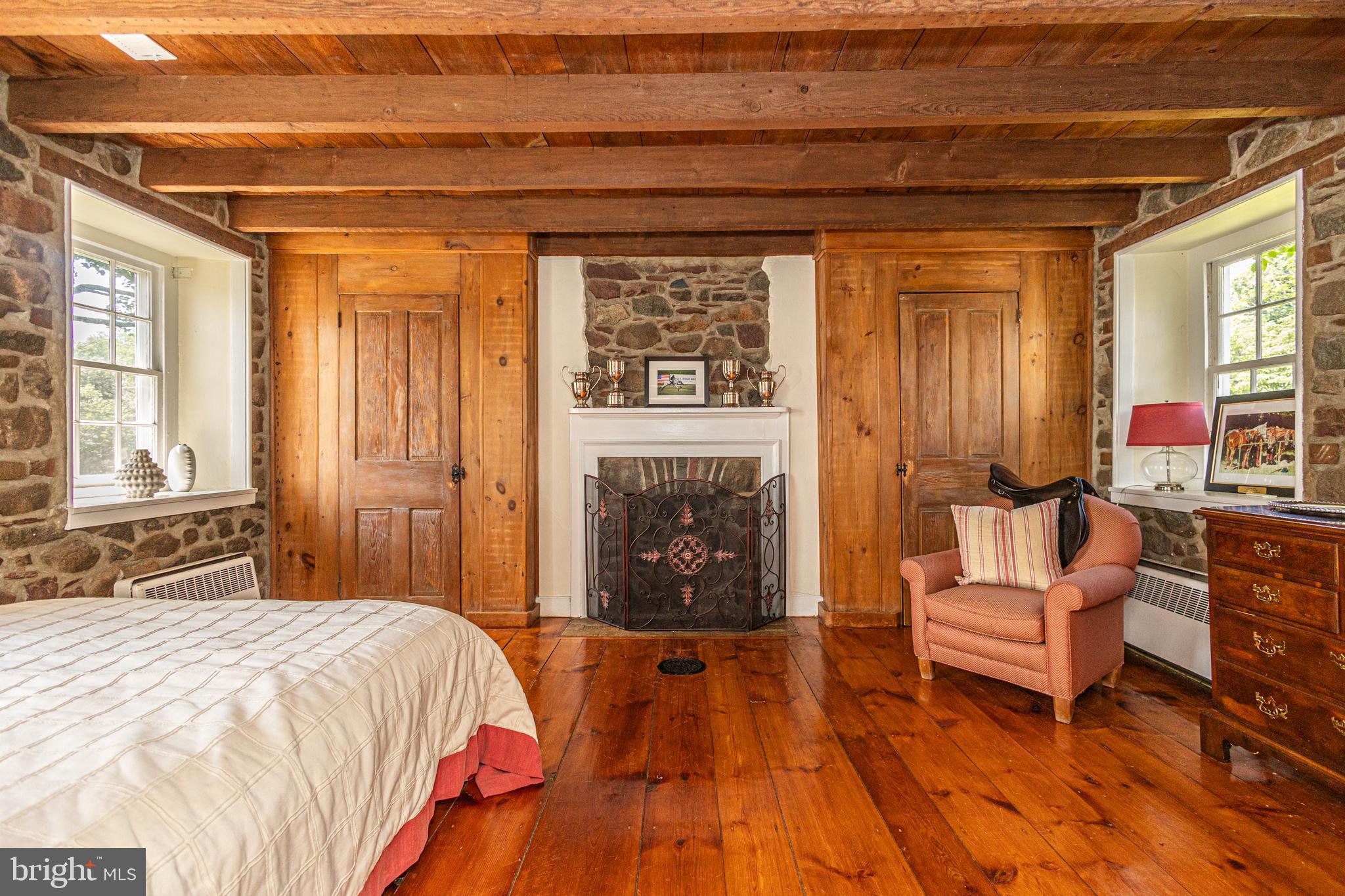439 Brownsburg Road, Unit W Newtown, PA 18940 - Photo 35 of 68 a bedroom with a bed and a fireplace