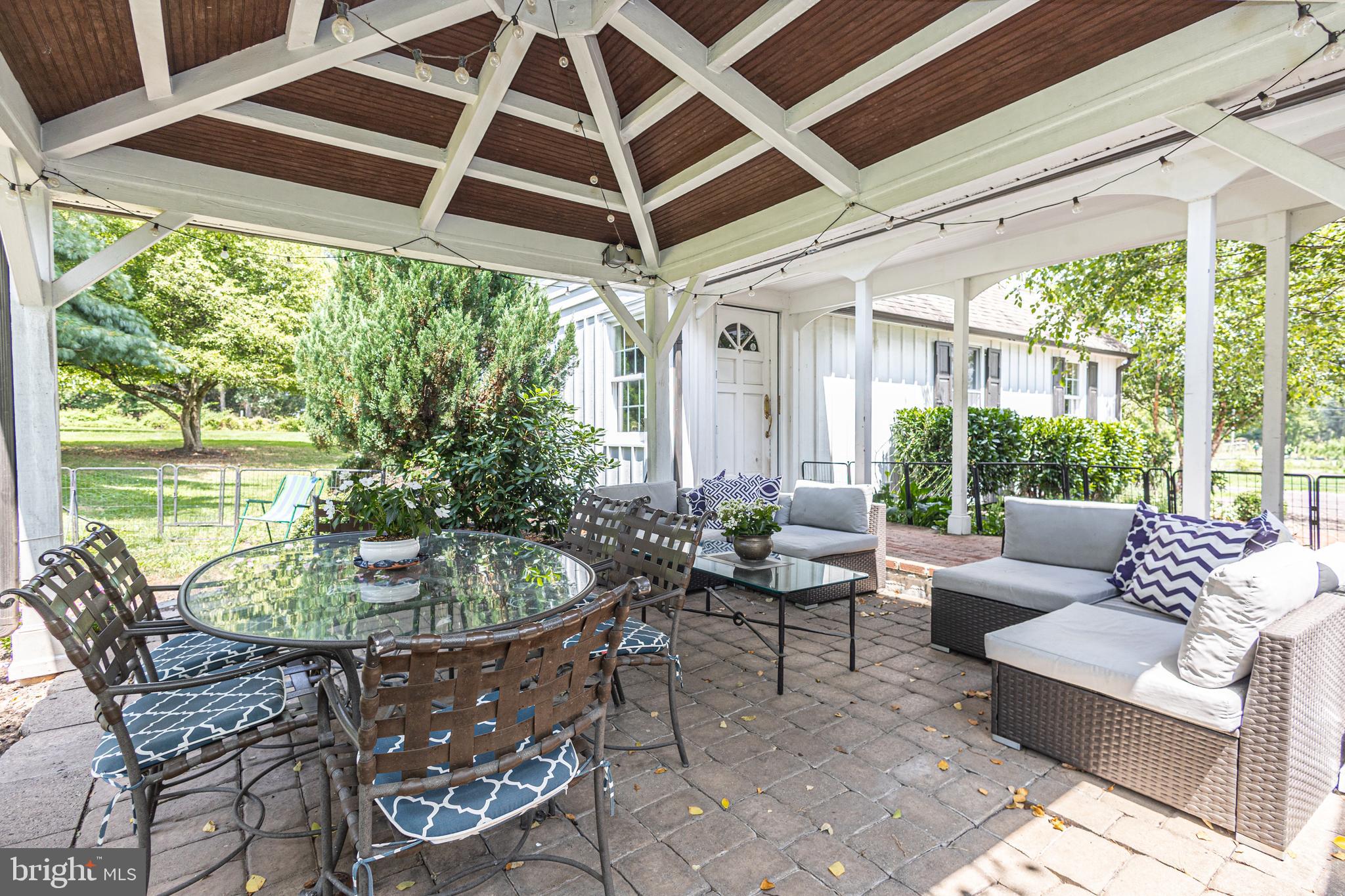 439 Brownsburg Road, Unit W Newtown, PA 18940 - Photo 40 of 68 a living room with patio furniture and a large window