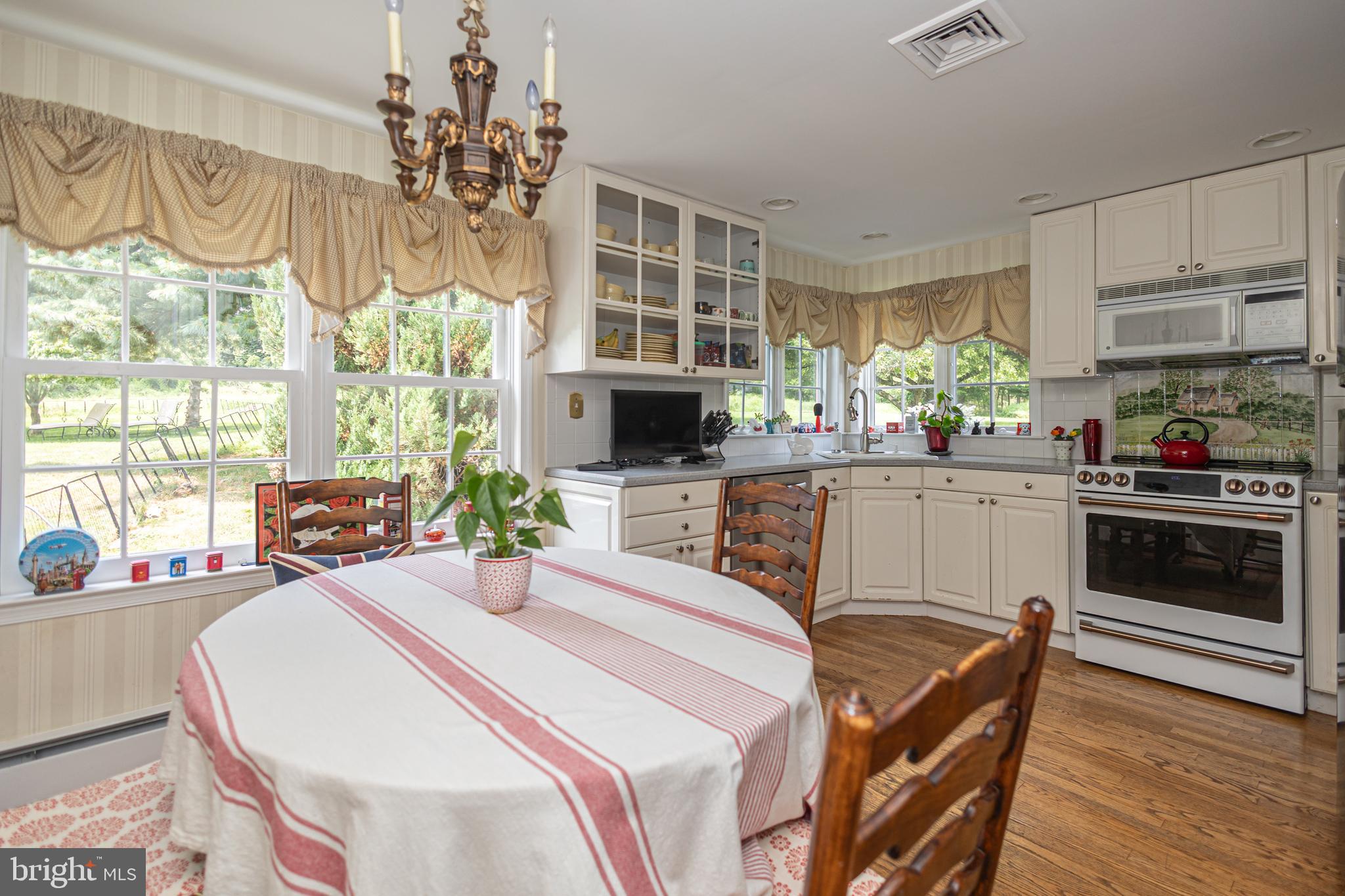 439 Brownsburg Road, Unit W Newtown, PA 18940 - Photo 47 of 68 a kitchen with a sink a stove and a chandelier
