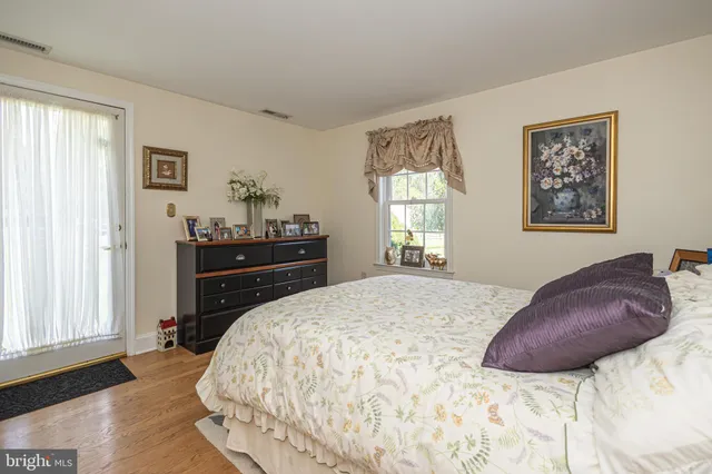 an aerial view of a house with yard and green space
