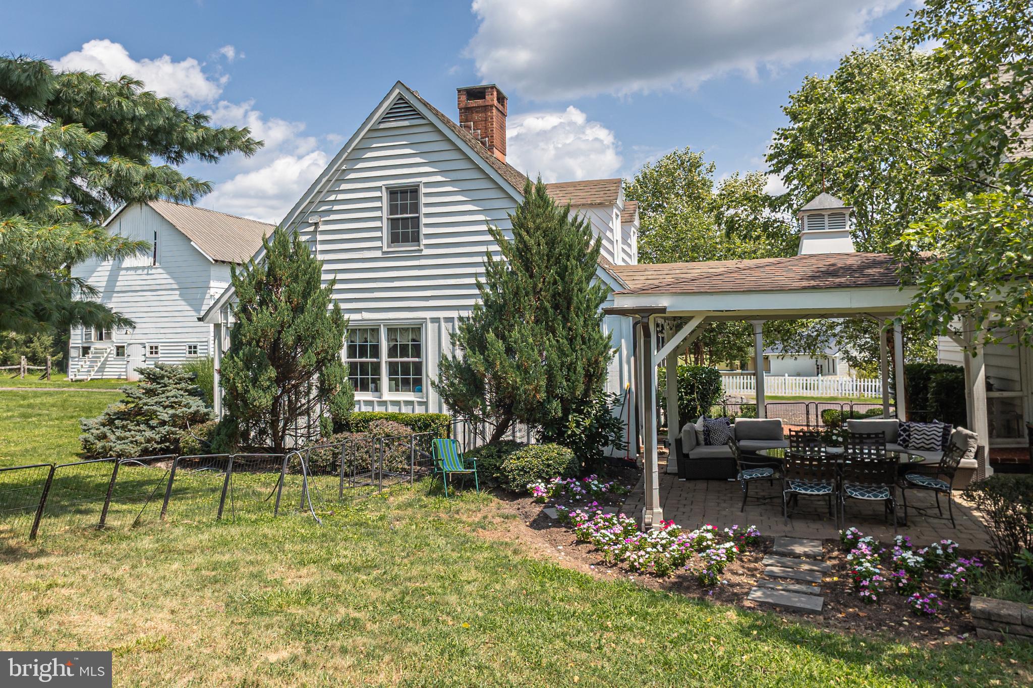 439 Brownsburg Road, Unit W Newtown, PA 18940 - Photo 56 of 68 a backyard of a house with yard table and chairs