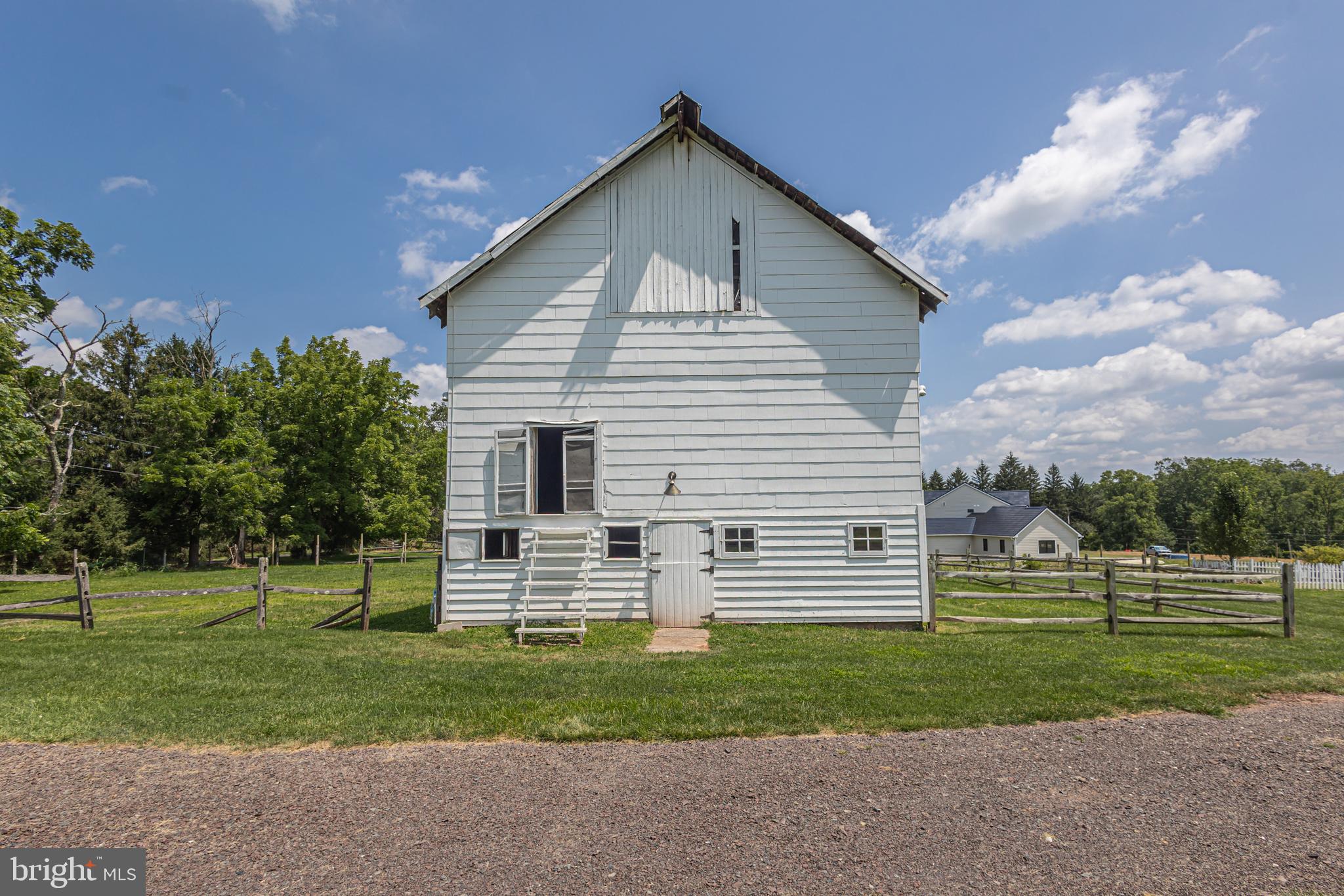 439 Brownsburg Road, Unit W Newtown, PA 18940 - Photo 62 of 68 a view of a house with a yard