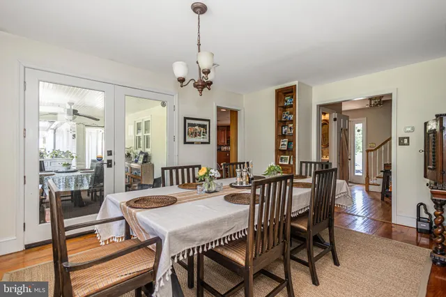 a living room with furniture a fireplace and a table