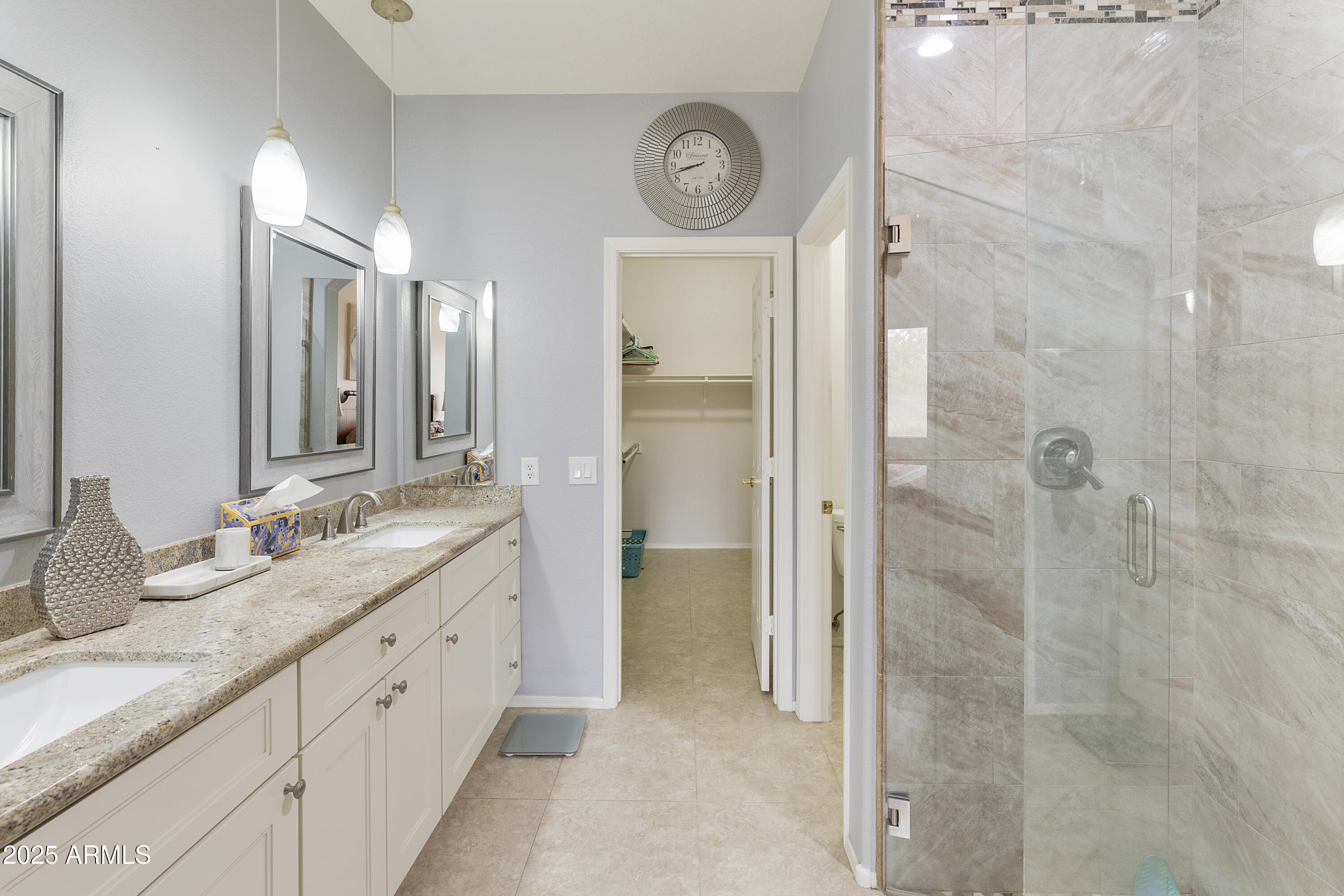 23745 South Vacation Way Sun Lakes, AZ 85248 - Photo 20 of 52 a bathroom with a granite countertop mirror and a shower