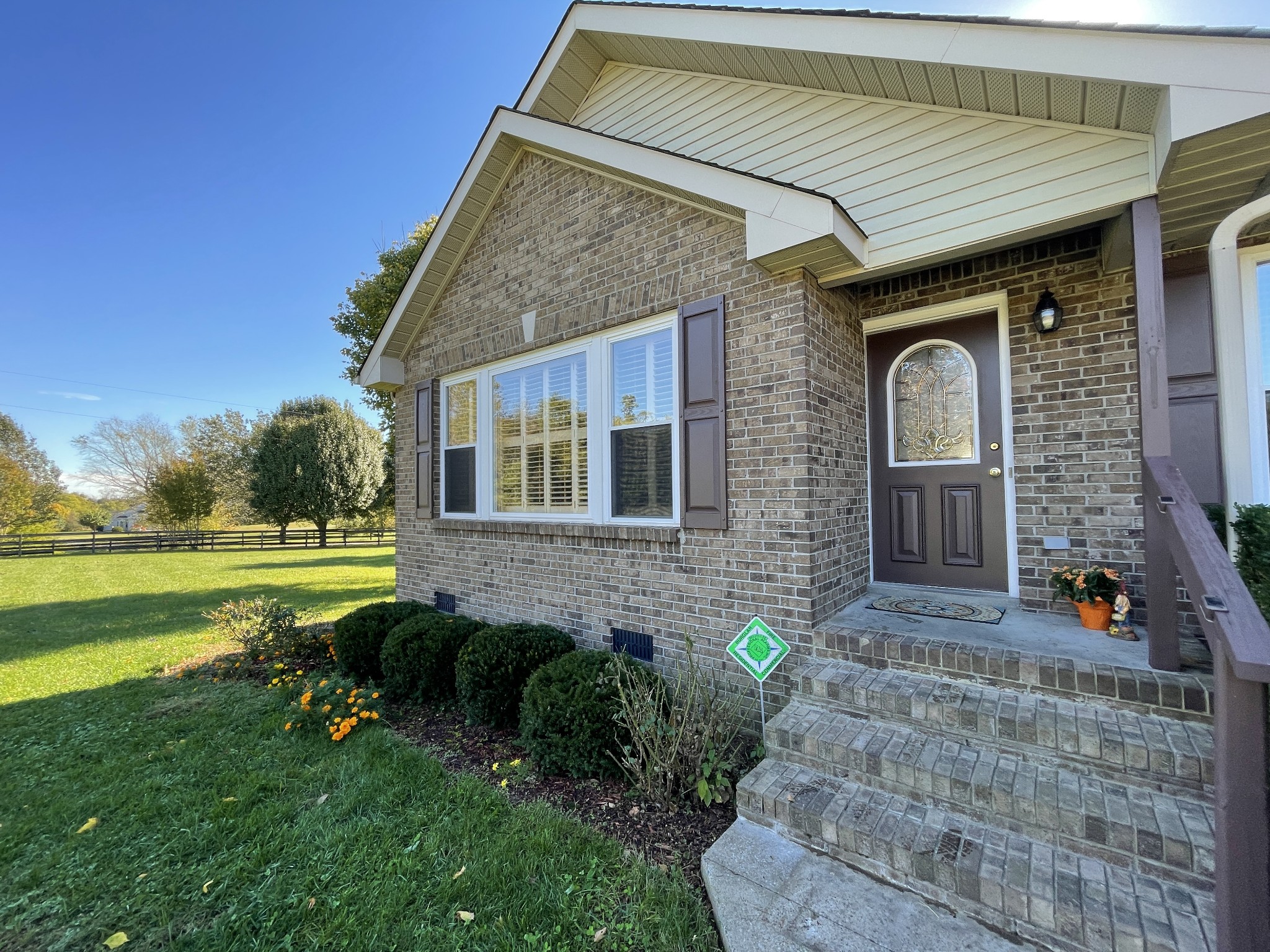 2946 Old Clarksville Sprgfld Road Adams, TN 37010 - Photo 2 of 24 a front view of a house with garden