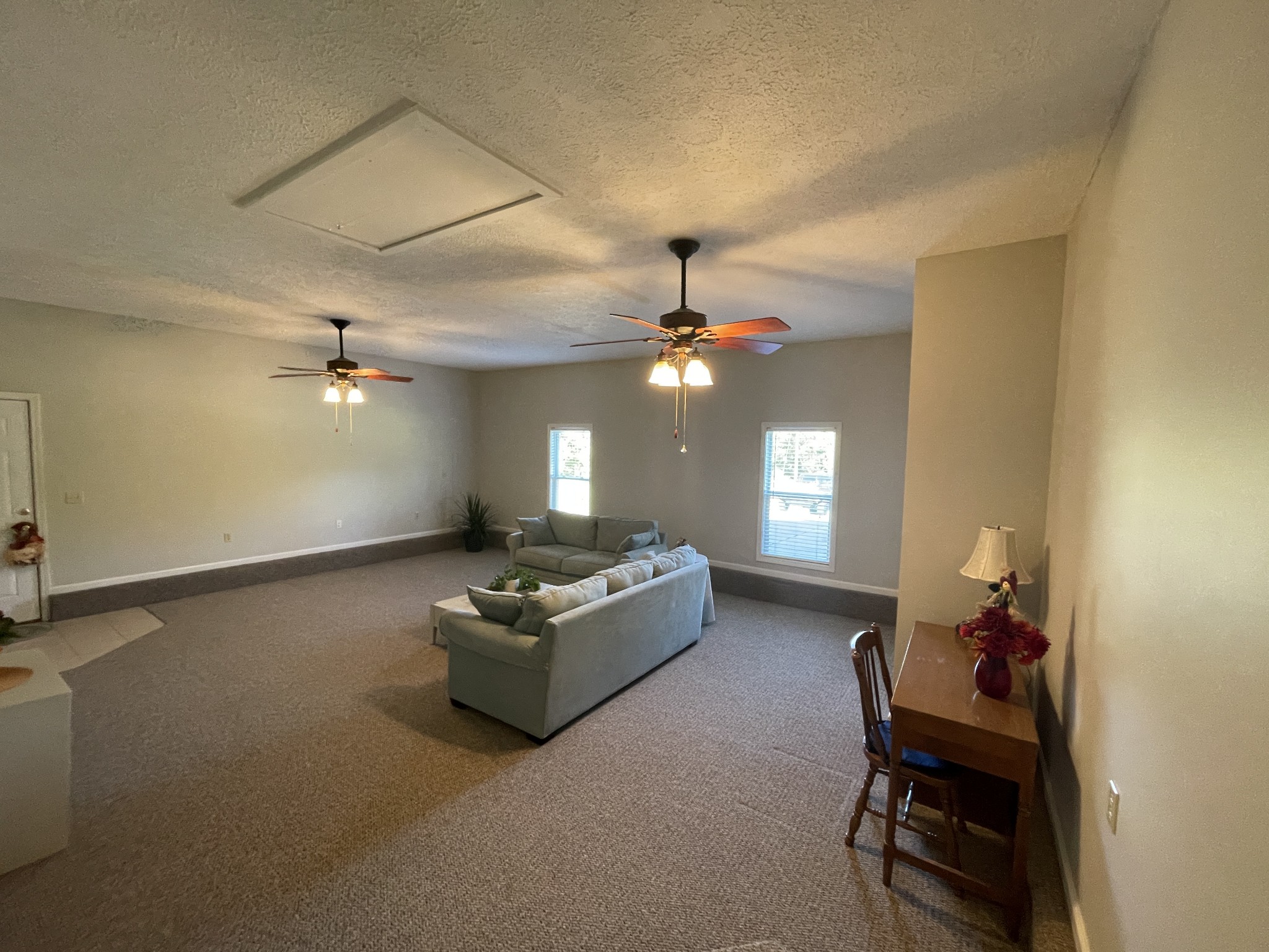 2946 Old Clarksville Sprgfld Road Adams, TN 37010 - Photo 12 of 24 a living room with furniture and a chandelier