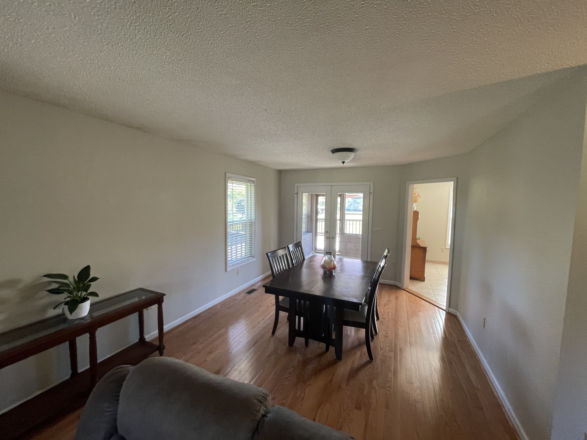 2946 Old Clarksville Sprgfld Road Adams, TN 37010 - Photo 15 of 24 a view of a dining room with furniture and wooden floor