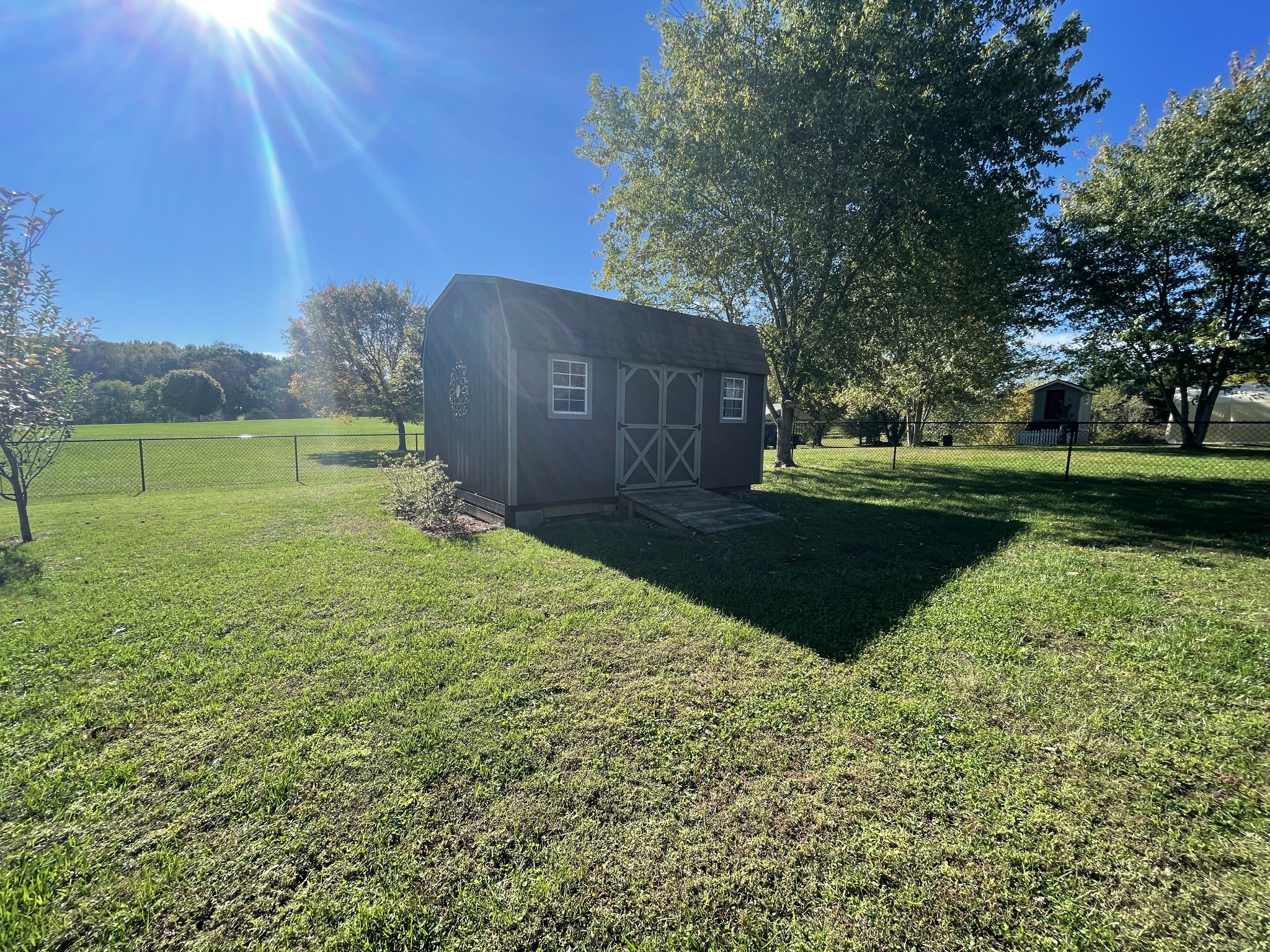 2946 Old Clarksville Sprgfld Road Adams, TN 37010 - Photo 23 of 24 a view of a backyard with large trees