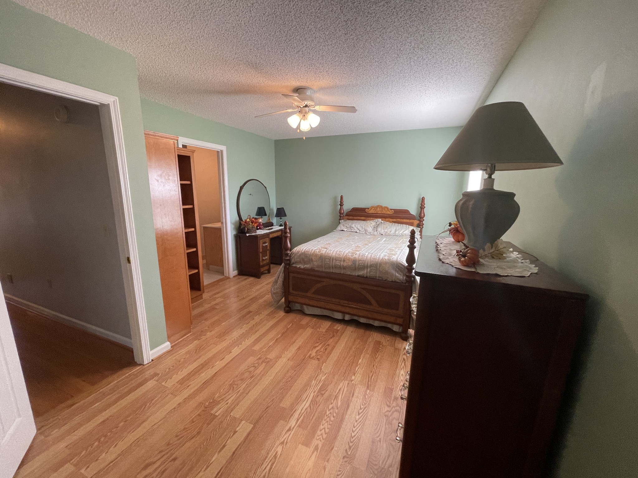 2946 Old Clarksville Sprgfld Road Adams, TN 37010 - Photo 7 of 24 a bedroom with a bed and a chandelier