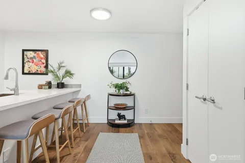 a room with table and a potted plant