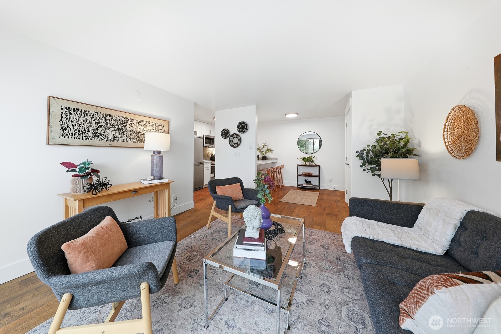 3401 Wallingford Avenue North, Unit 408 Seattle, WA 98103 - Photo 7 of 15 a living room with furniture and wooden floor
