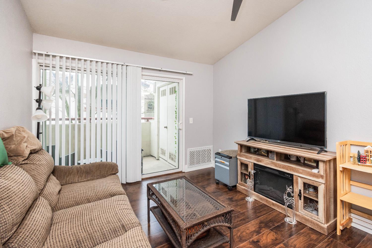 8020 Walerga Road, Unit 1238 Antelope, CA 95843 - Photo 12 of 22 a living room with furniture and a flat screen tv