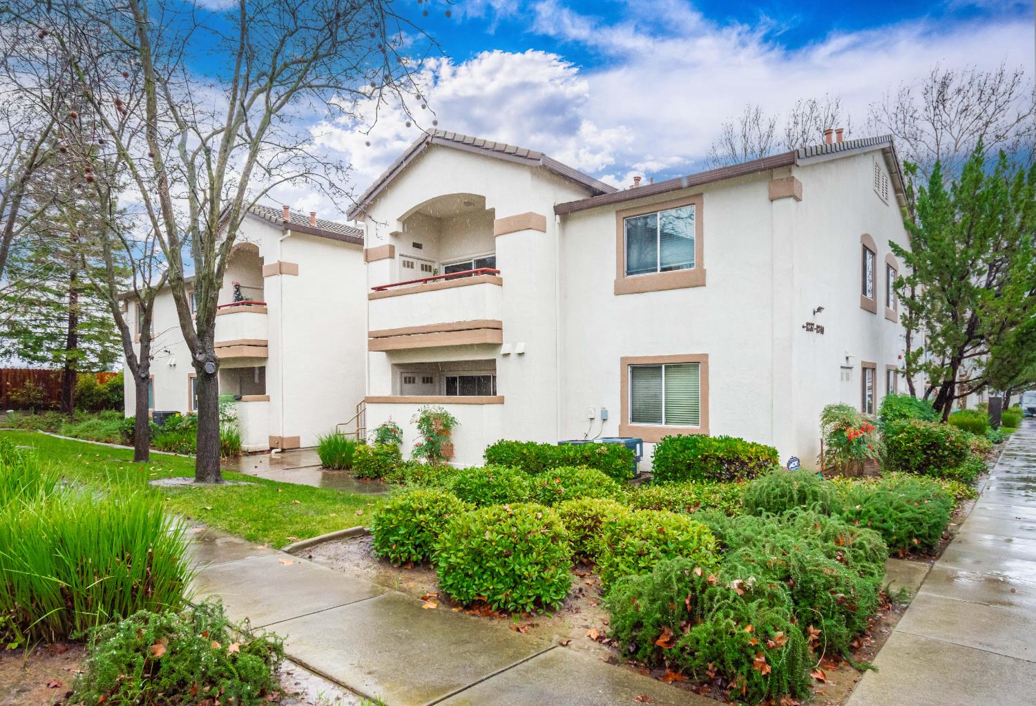 8020 Walerga Road, Unit 1238 Antelope, CA 95843 - Photo 4 of 22 a view of a white house with a big yard and potted plants