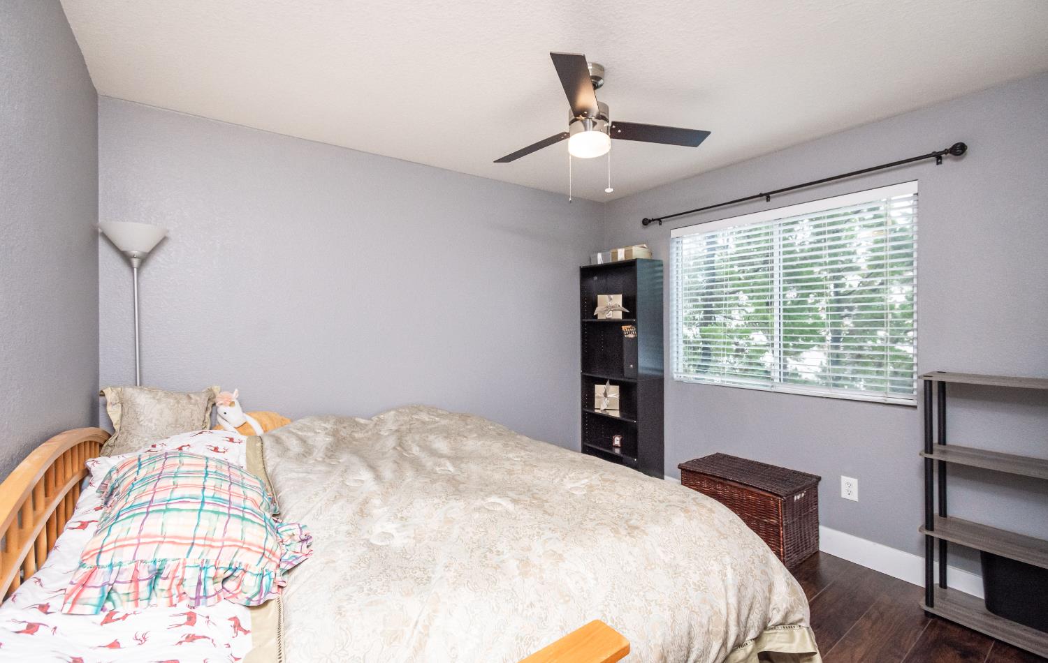 8020 Walerga Road, Unit 1238 Antelope, CA 95843 - Photo 7 of 22 a bedroom with a bed and a chandelier