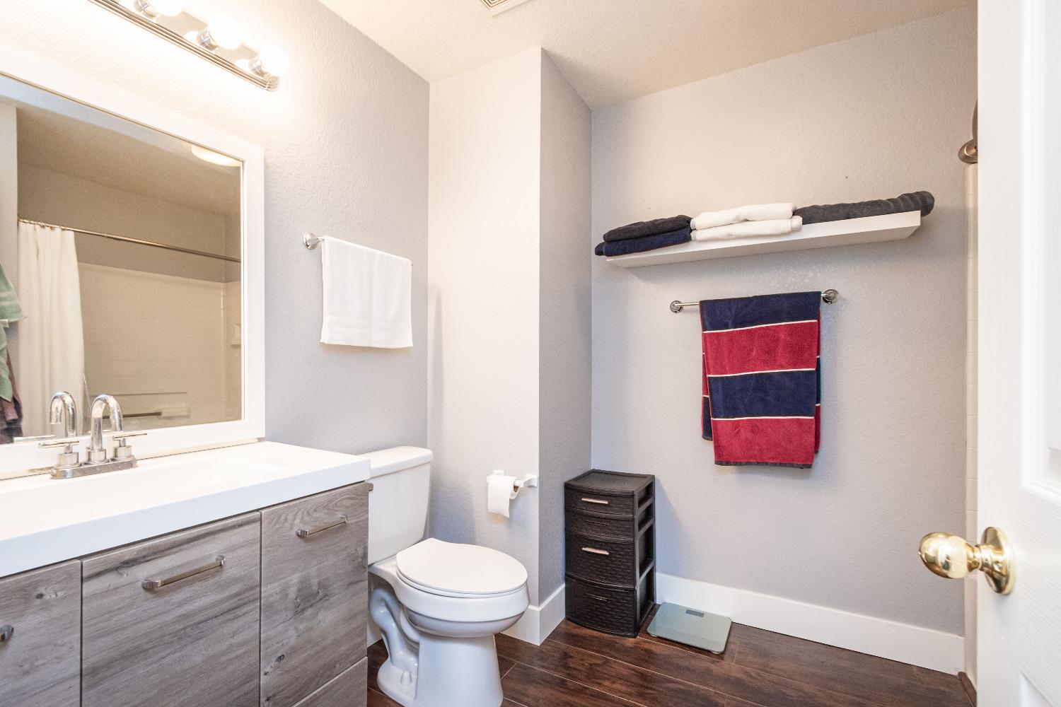 8020 Walerga Road, Unit 1238 Antelope, CA 95843 - Photo 9 of 22 a bathroom with a toilet sink vanity and mirror