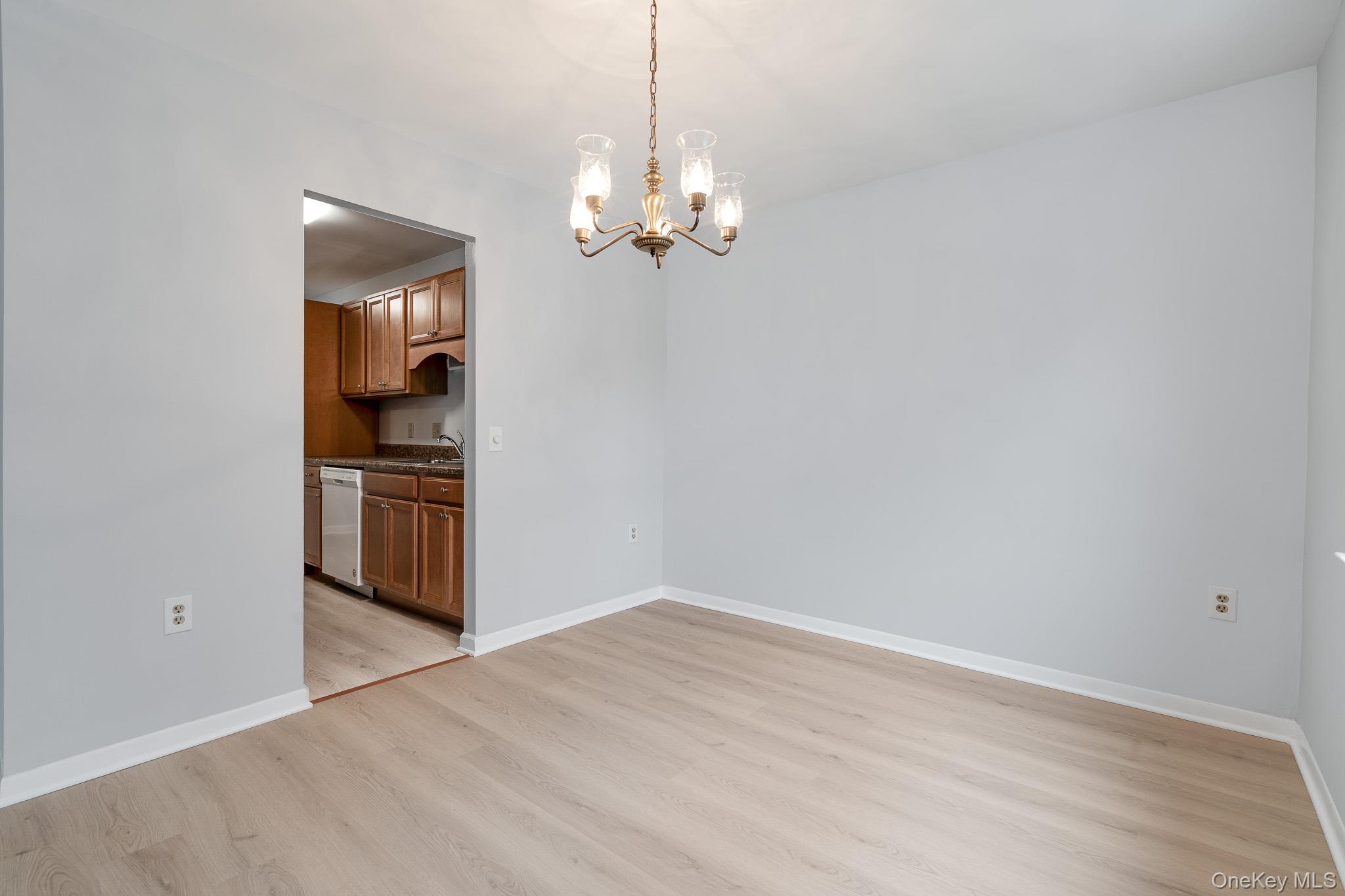 902 Commons Way, Unit F Fishkill, NY 12524 - Photo 7 of 21 a view of kitchen with refrigerator and stove