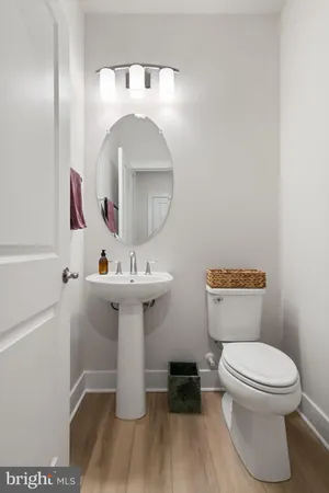 a living room with furniture and a book shelf