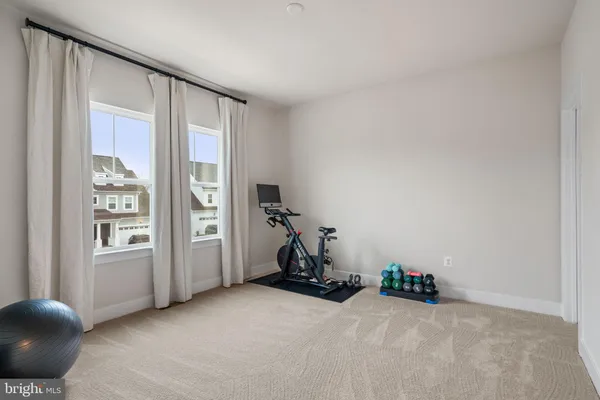 a view of a swimming pool with a table and chairs