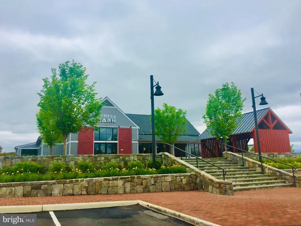 a view of a swimming pool with a yard