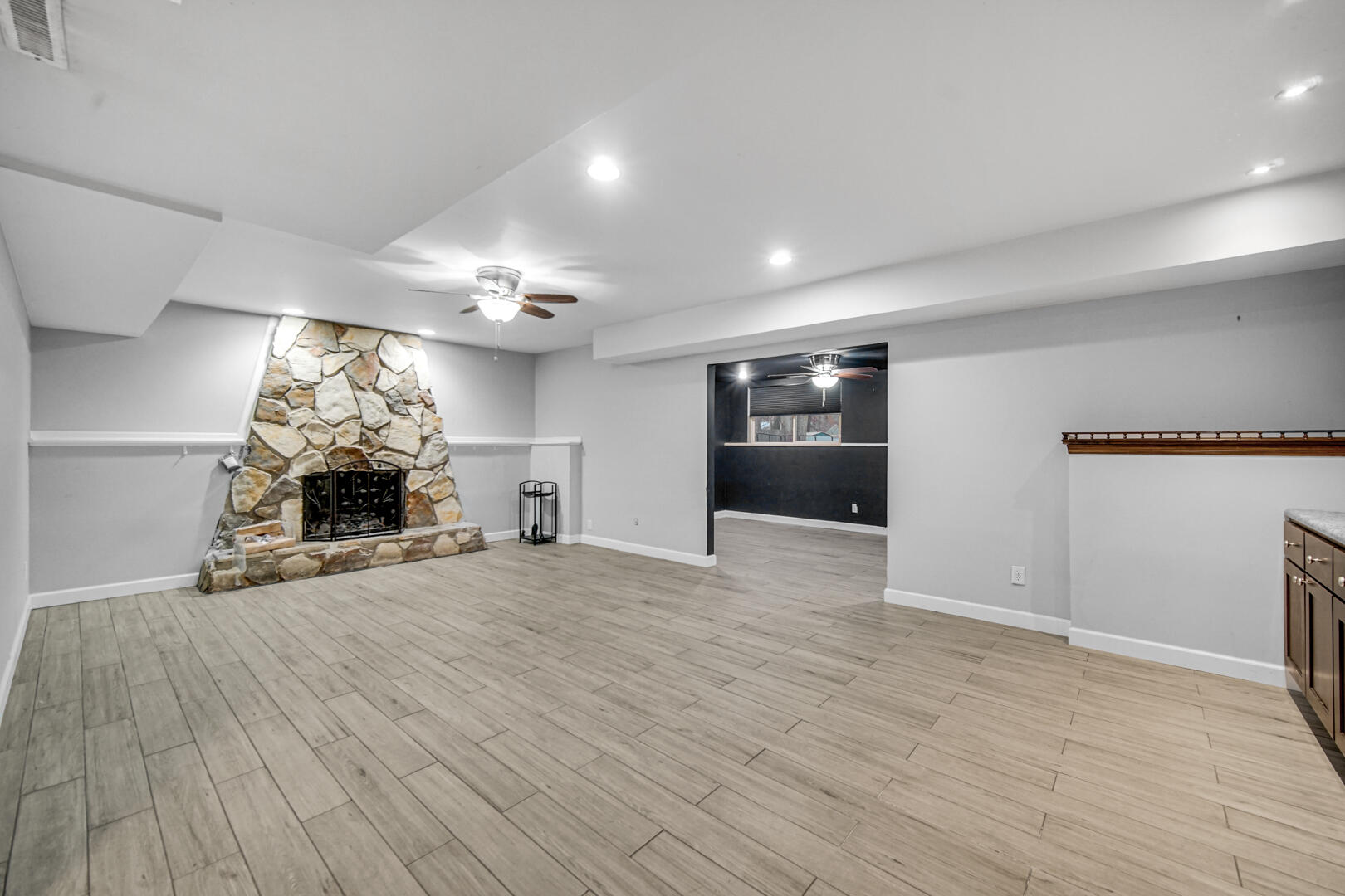 6747 West 450 Road North Michigan City, IN 46360 - Photo 11 of 37 an empty room with kitchen and fireplace