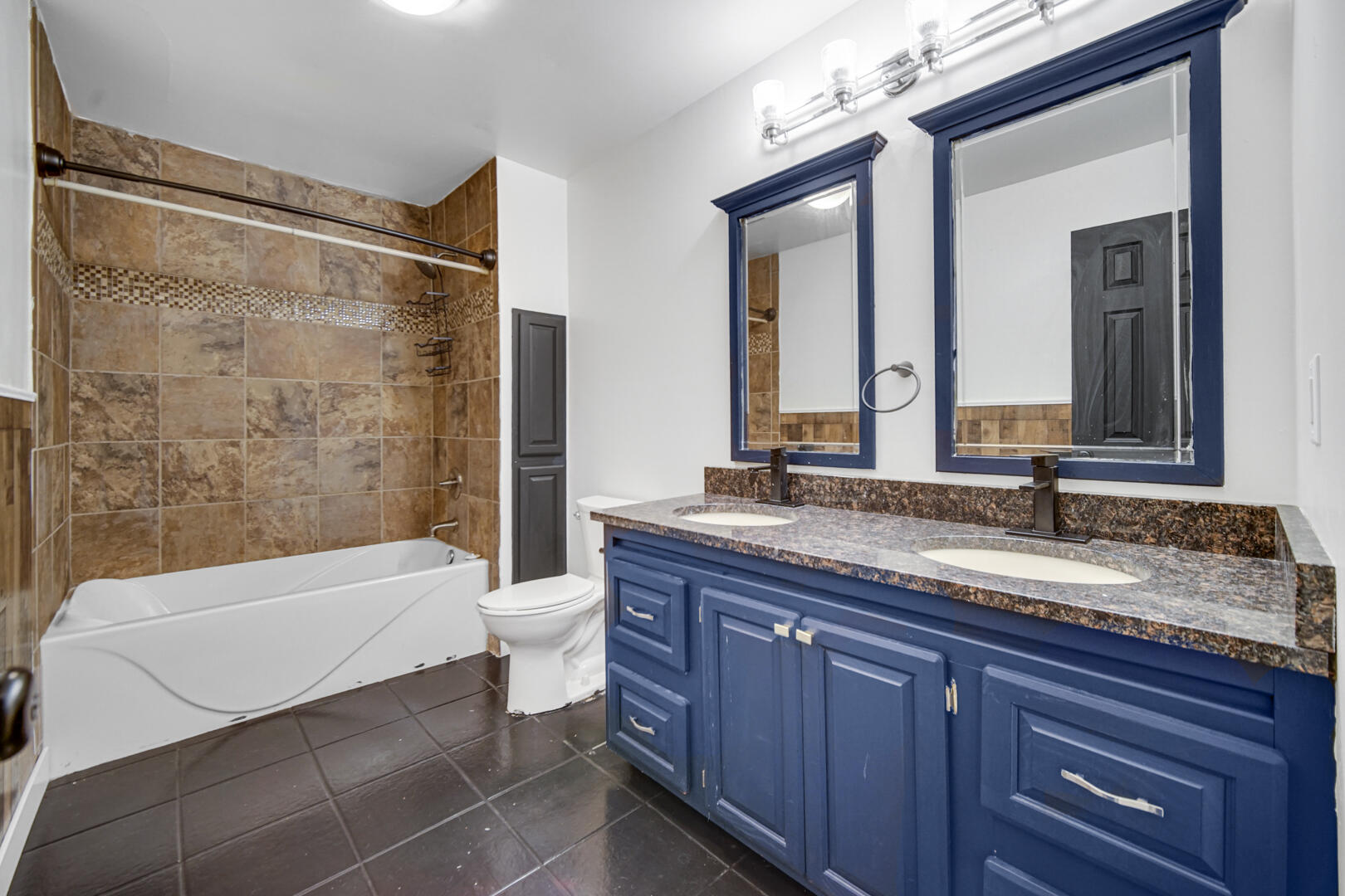 6747 West 450 Road North Michigan City, IN 46360 - Photo 21 of 37 a bathroom with a granite countertop tub sink and mirror