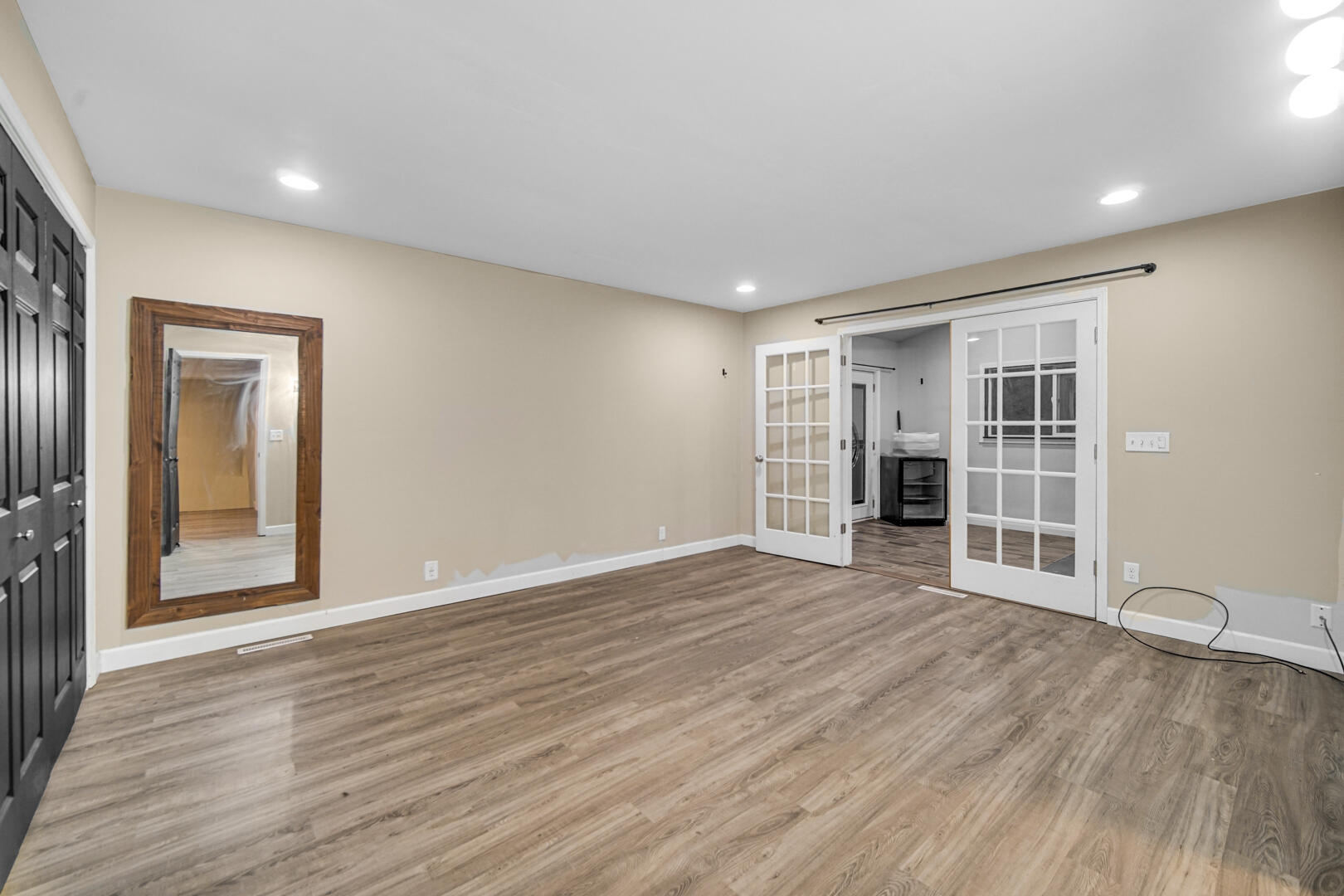 6747 West 450 Road North Michigan City, IN 46360 - Photo 24 of 37 a view of an empty room with wooden floor and a window