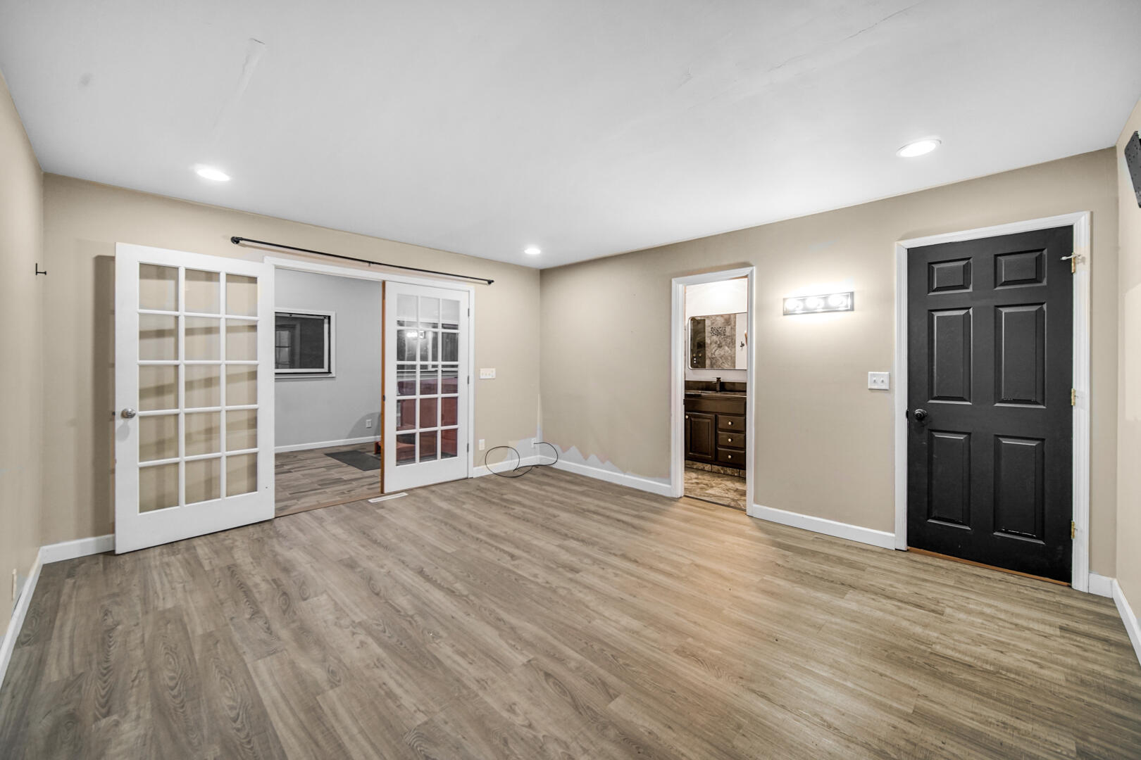 6747 West 450 Road North Michigan City, IN 46360 - Photo 25 of 37 wooden floor in an empty room with a window