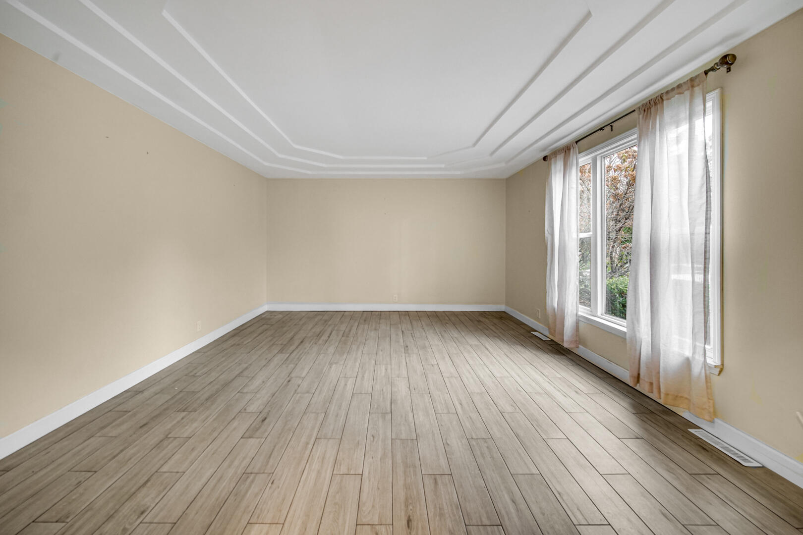 6747 West 450 Road North Michigan City, IN 46360 - Photo 6 of 37 wooden floor in an empty room with a window