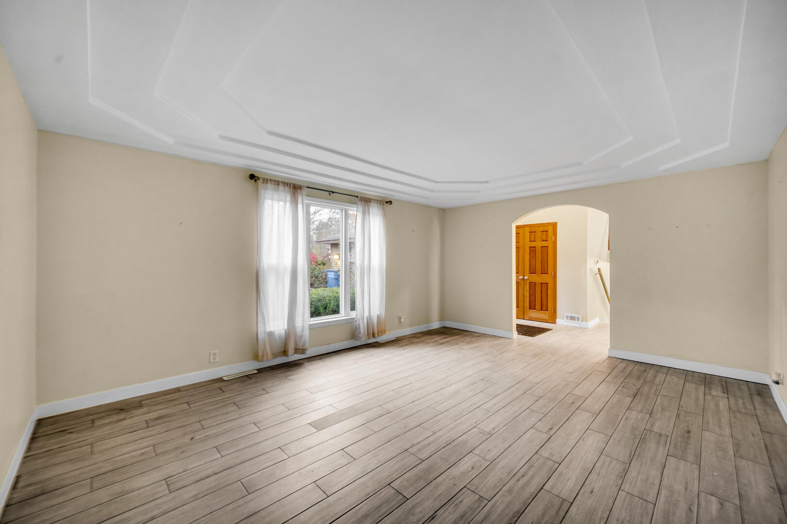 6747 West 450 Road North Michigan City, IN 46360 - Photo 7 of 37 a view of an empty room with wooden floor and a window