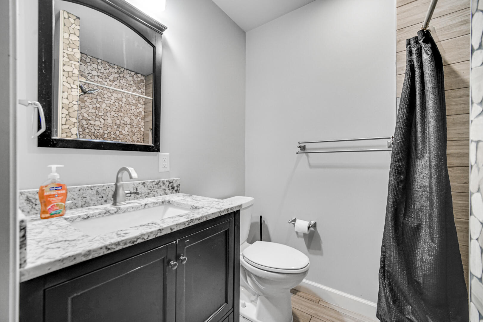 6747 West 450 Road North Michigan City, IN 46360 - Photo 9 of 37 a bathroom with a granite countertop sink toilet and a mirror