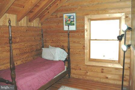10677 River Road Rixeyville, VA 22737 - Photo 18 of 26 a bedroom with a bed and a window