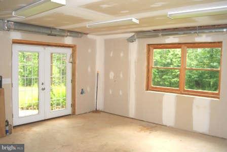 10677 River Road Rixeyville, VA 22737 - Photo 23 of 26 a view of empty room with window and front door